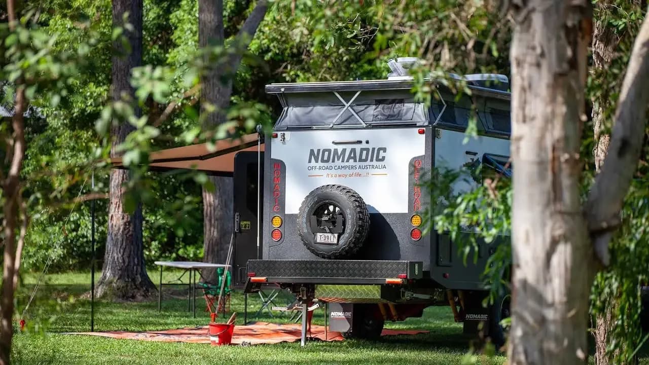 Nomadic camper set up in a shaded bush campsite