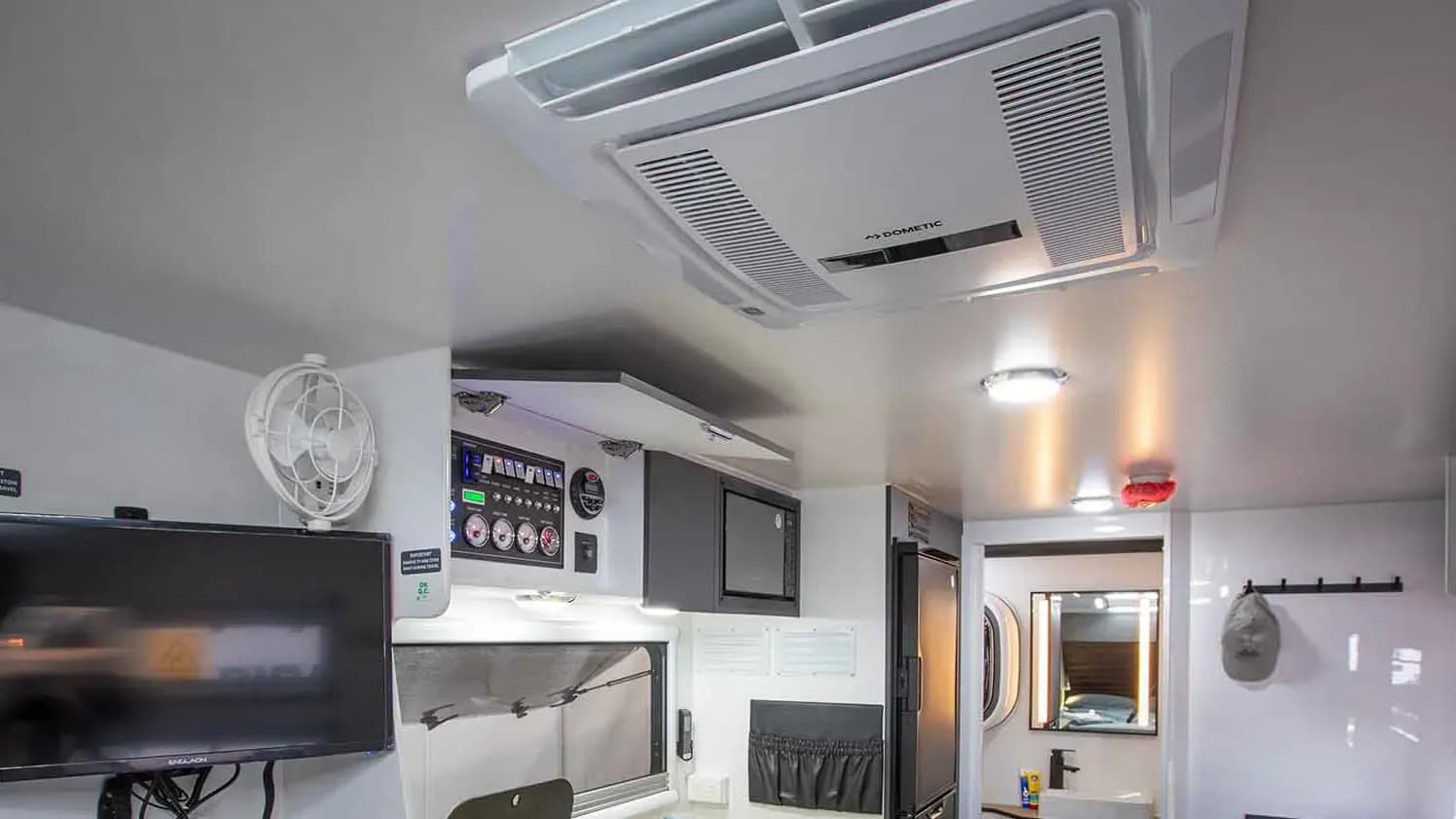 Dometic air conditioning and appliances in a Nomadic camper interior