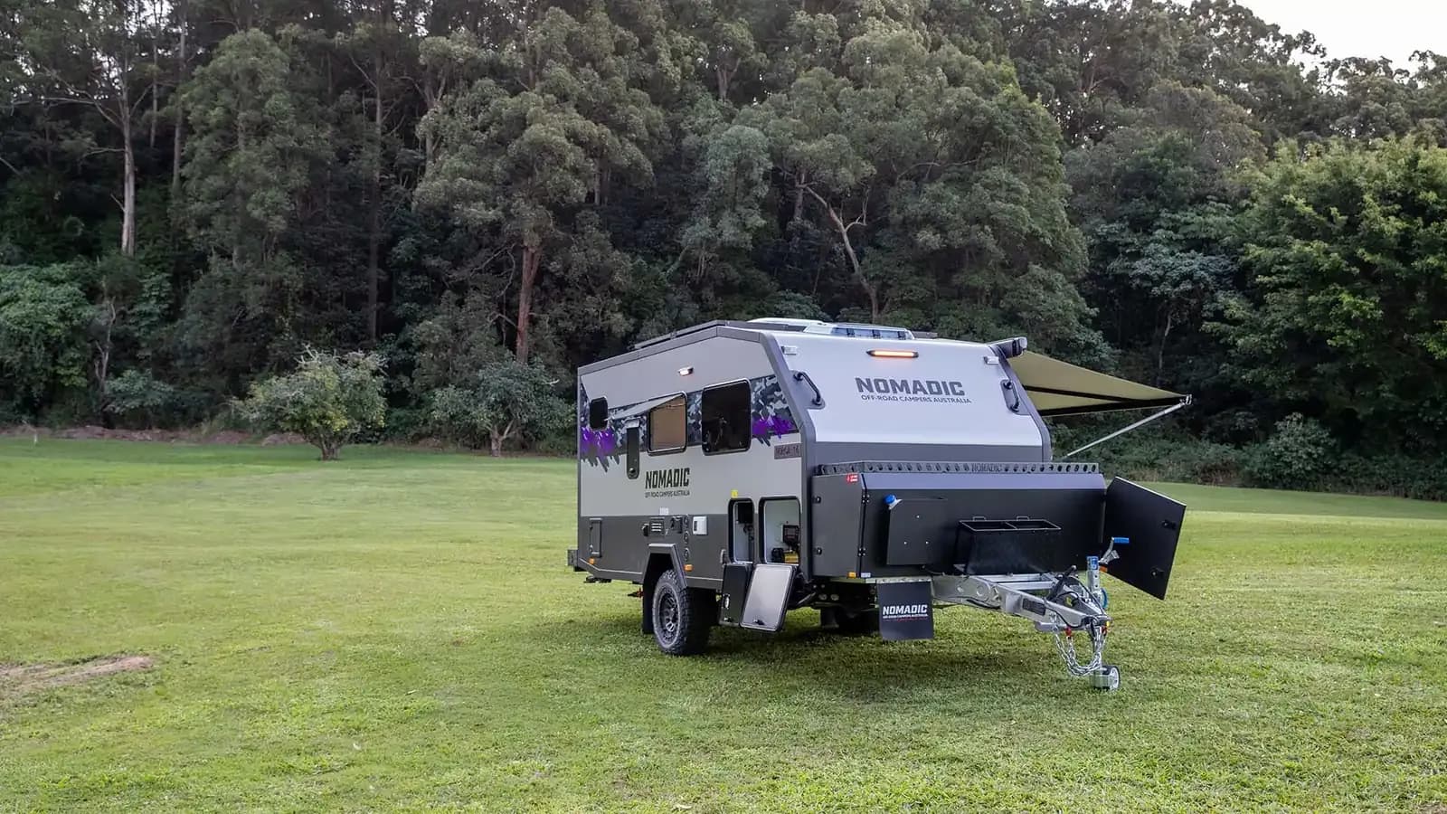 Nomadic couples range hybrid caravan at camp